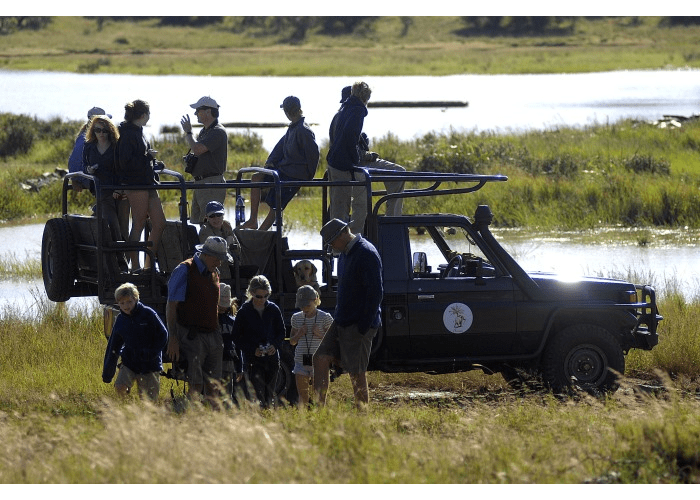 Children on game drive at Sosian Lodge, Laikipia, Kenya.