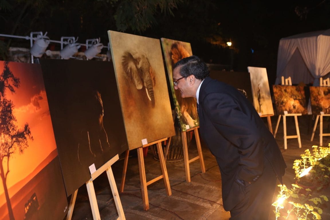 S.K. Srivastava, Former Secretary, Government of India, admiring the photographs